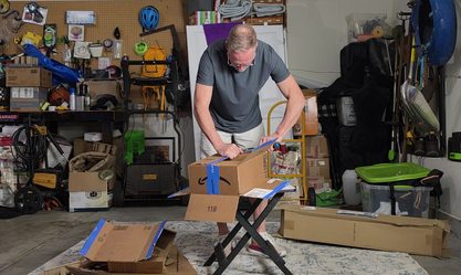 Moving boxes stacked on a table with the BoxHound cutter