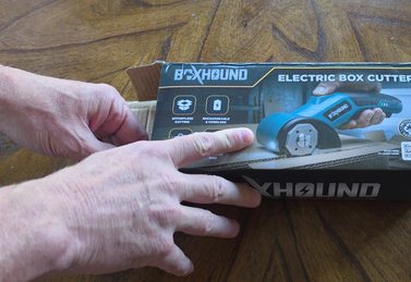 Customer unboxing the BoxHound Electric Box Cutter